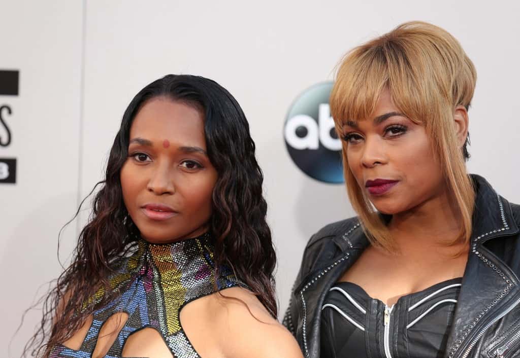 Chilli, left, and T-Boz of the musical group TLC arrive at the 2013 American Music Awards, on Sunday, Nov. 24, 2013 in Los Angeles. (Photo by Matt Sayles/Invision/AP)